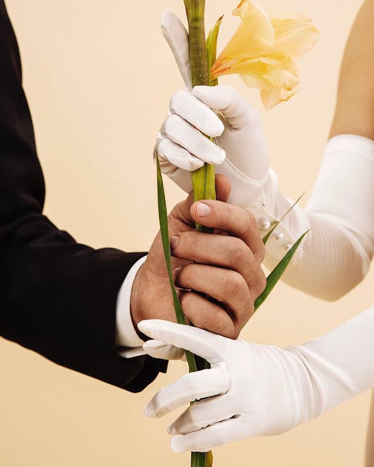 Picture of the man and woman holding flower