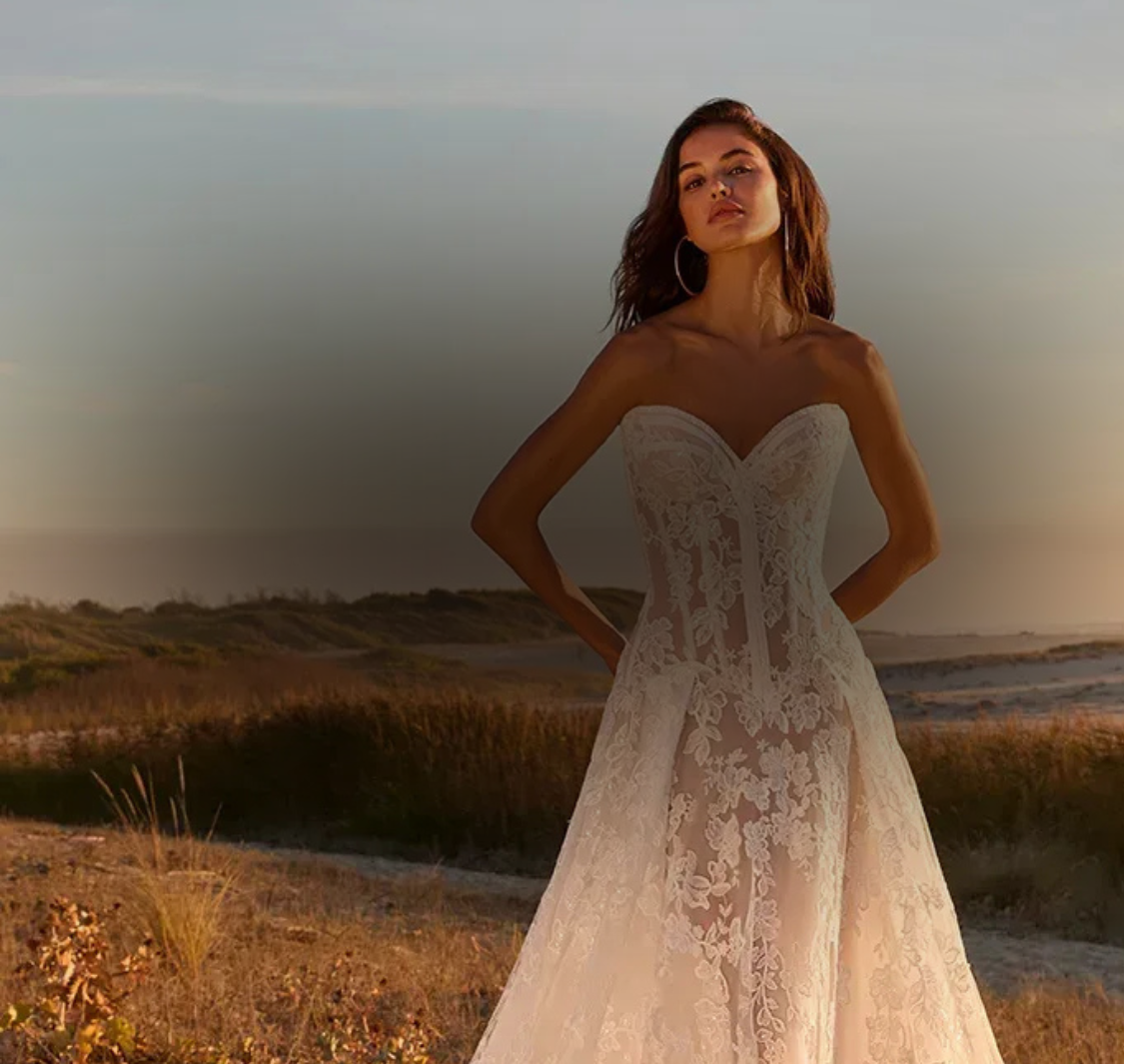 Model wearing a white gown. Mobile image