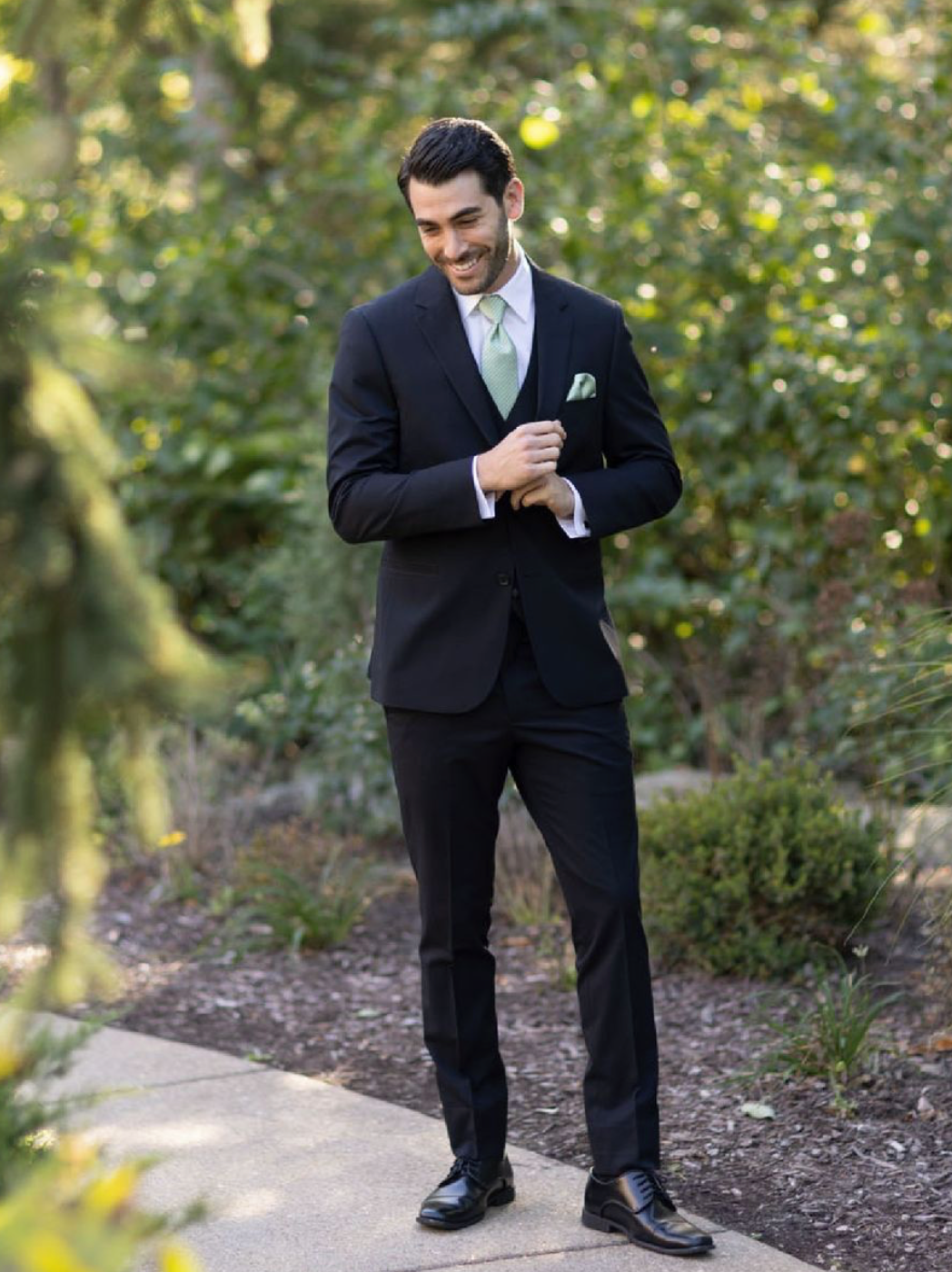 Model wearing a tuxedos suit