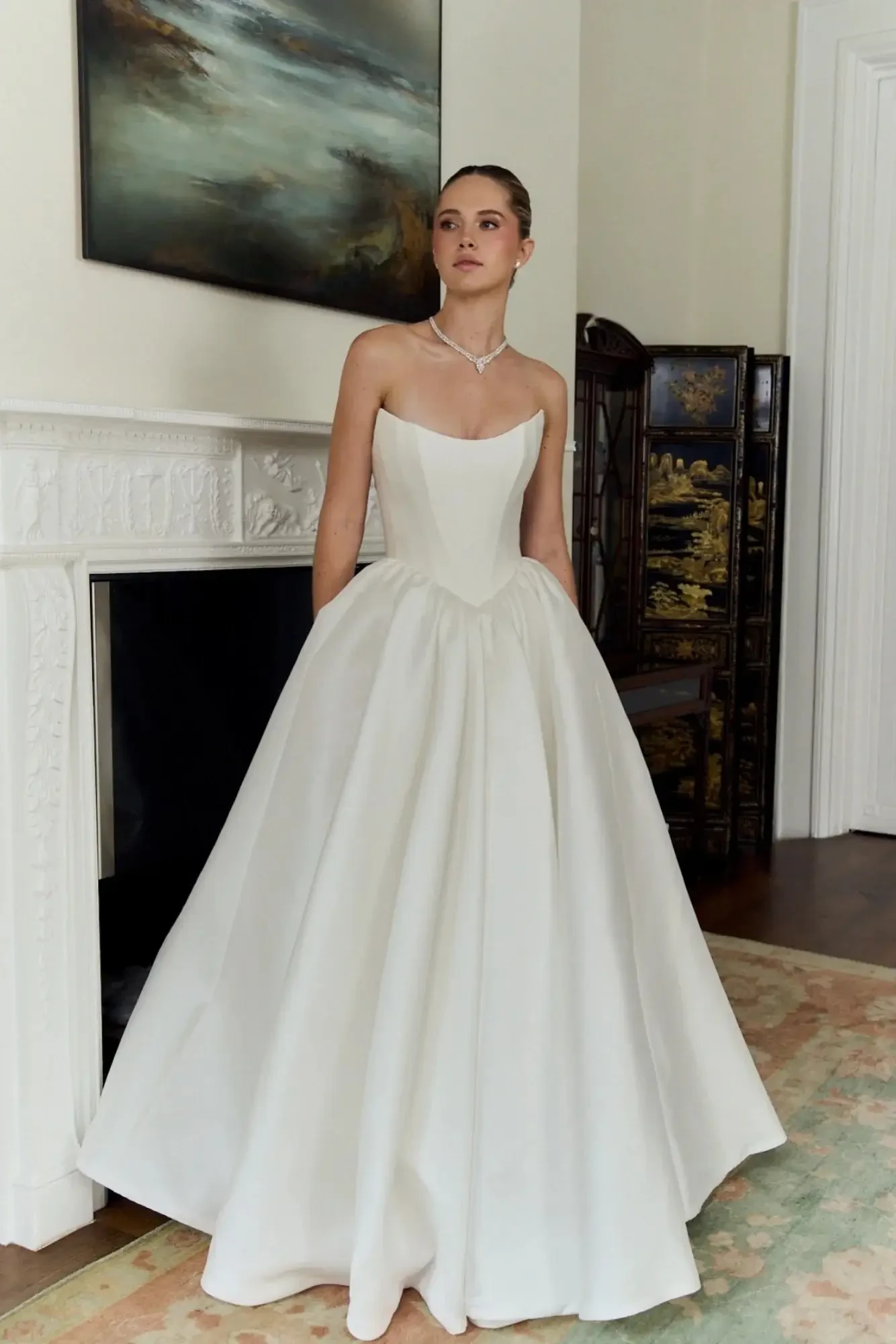 Model wearing White Peony dress by Caroline Castigliano